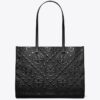 Borsa tote con monogramma T in rilievo