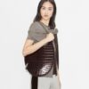 Borsa traforata con stampa cocco Borsa traforata con stampa cocco