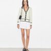 Cardigan corto in lana a coste