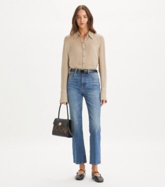 Jeans cropped a zampa