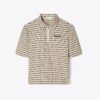 Polo con mezza zip tinta in filo