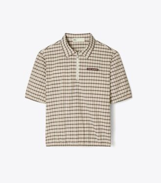 Polo con mezza zip tinta in filo