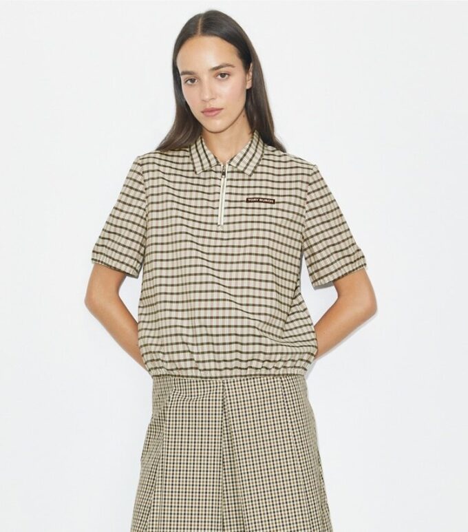 Polo con mezza zip tinta in filo