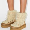 Stivali stringati in shearling morbido