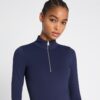 Top corto con mezza zip e maniche lunghe Top corto con mezza zip e maniche lunghe