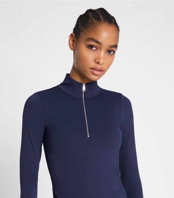 Top corto con mezza zip e maniche lunghe Top corto con mezza zip e maniche lunghe
